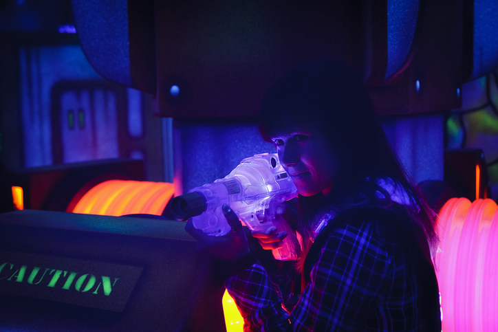 teenage girl playing laser tag